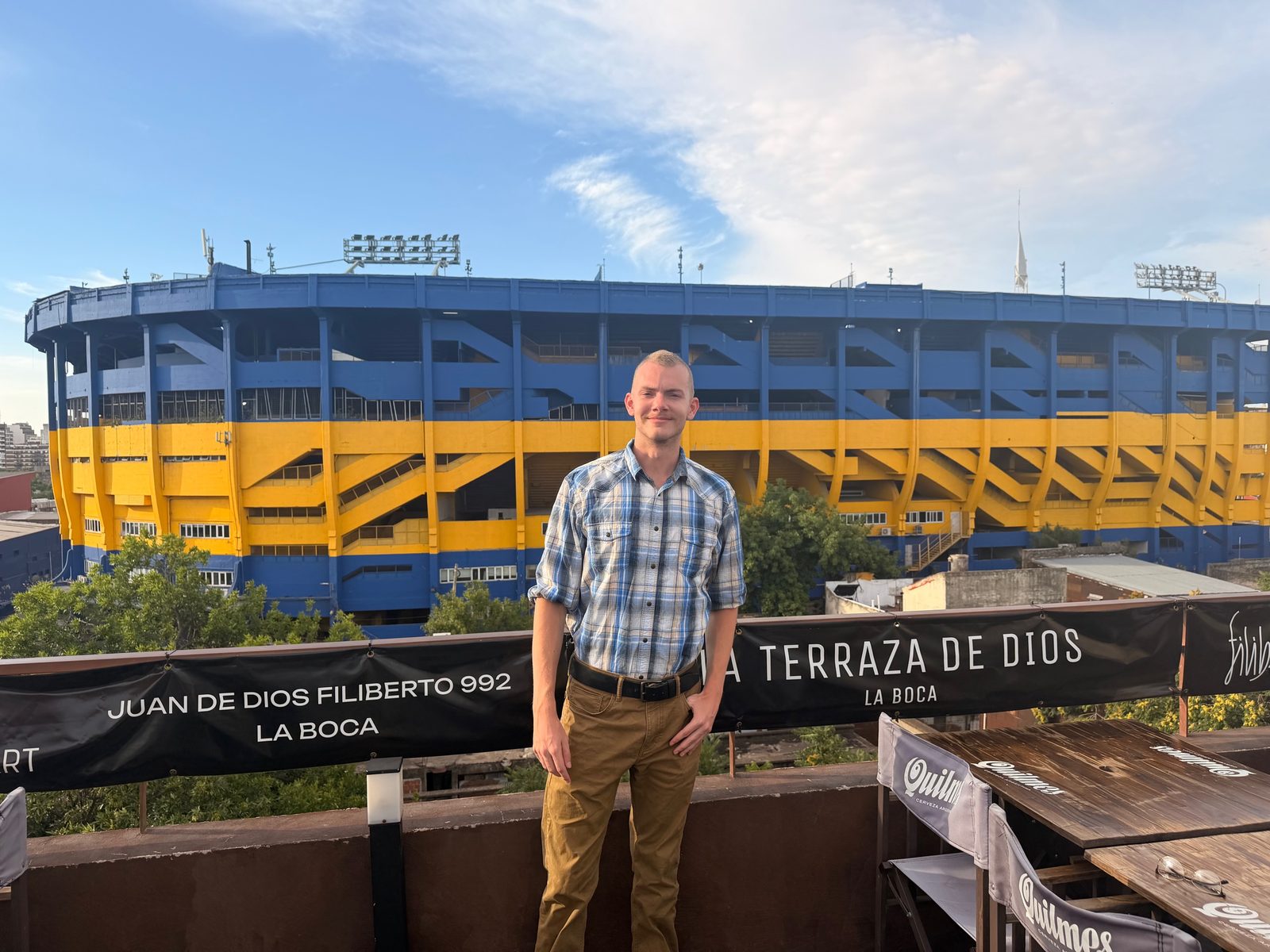 Joe Emerich in the La Boca neighbourhood of Buenos Aires, with La Bombonera stadium behind him.